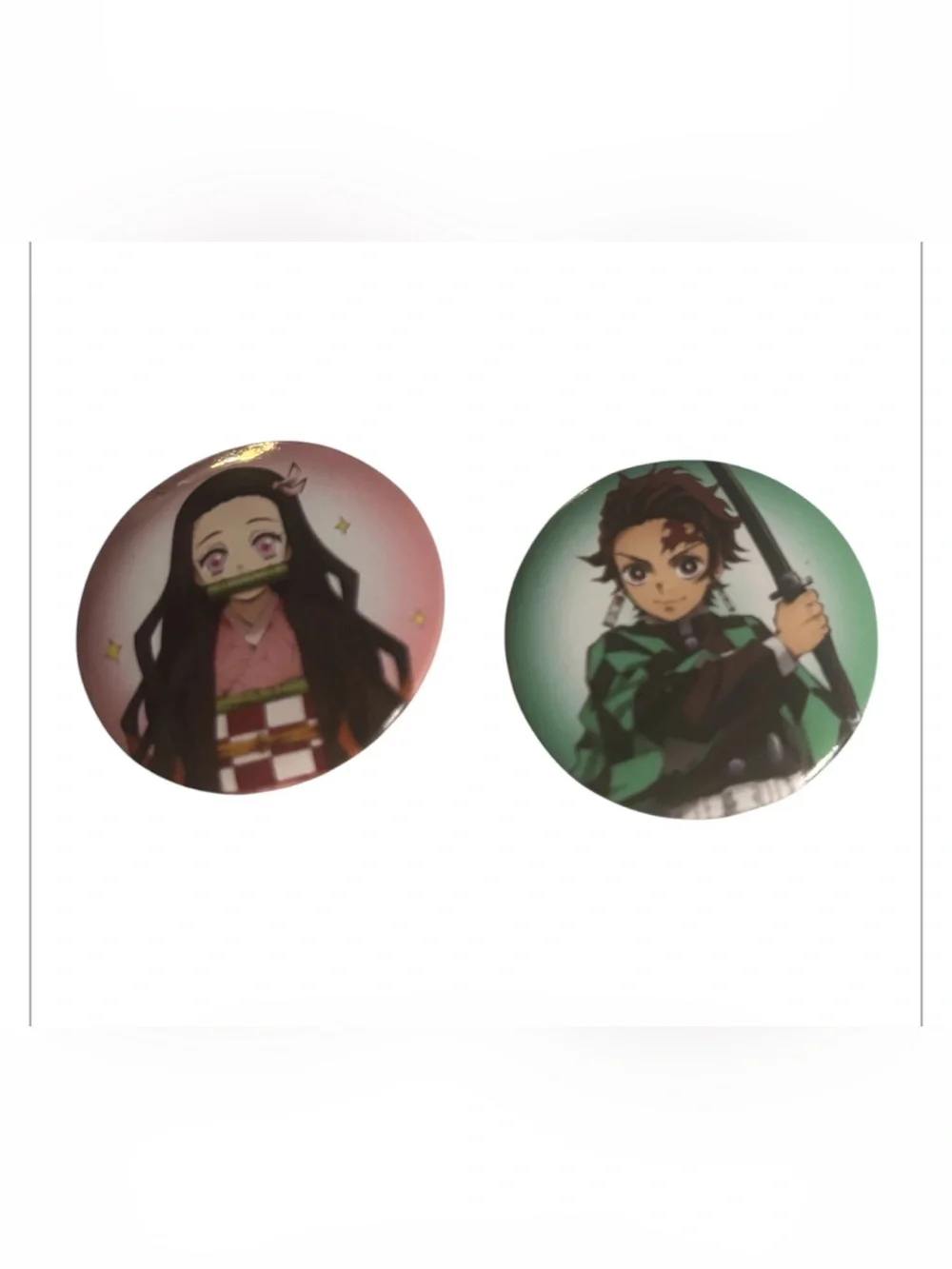 collectible button pins featuring Nezuko and Tanjiro Kamado